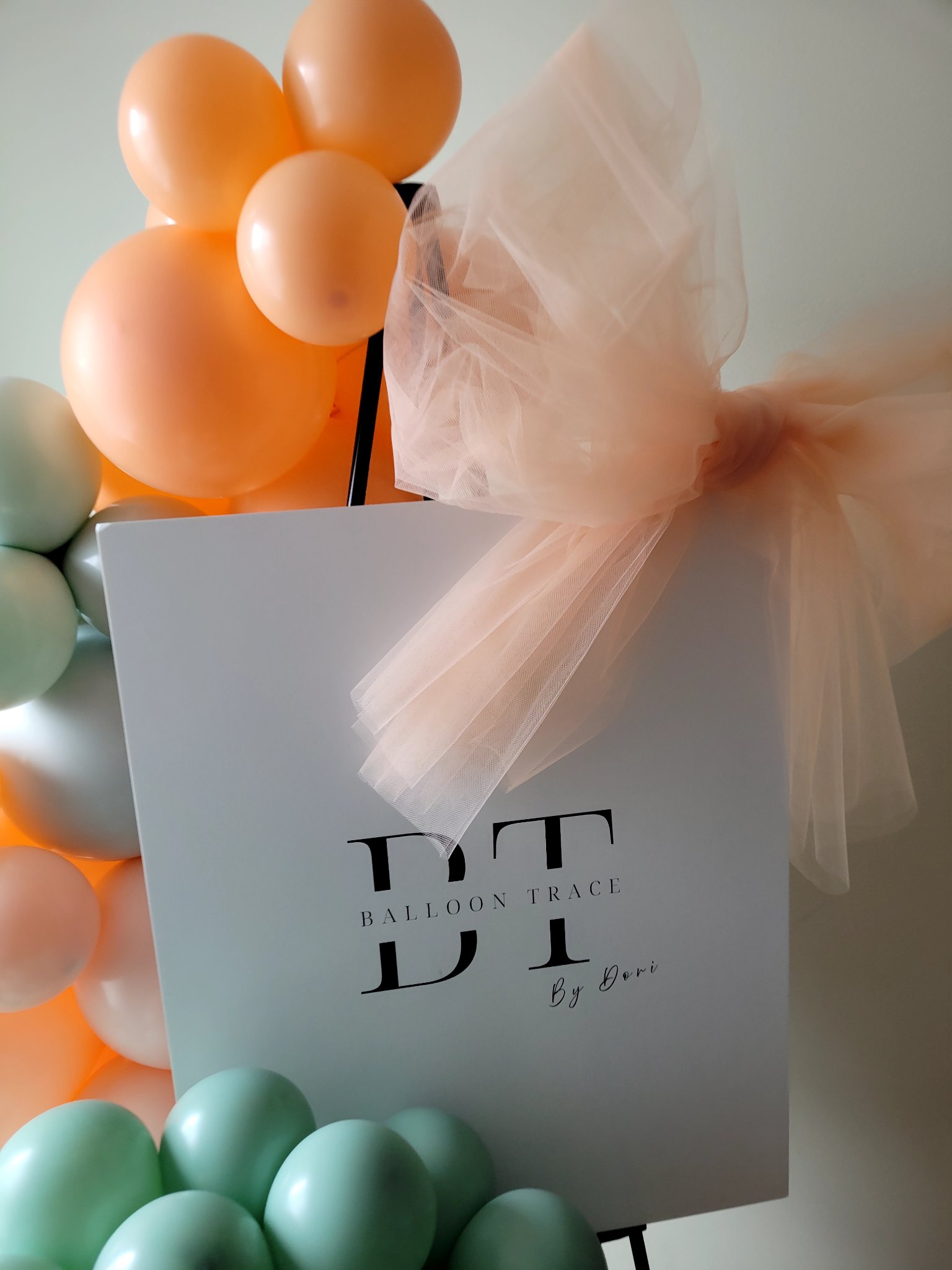 Balloon Trace by Dori sign with balloon garland