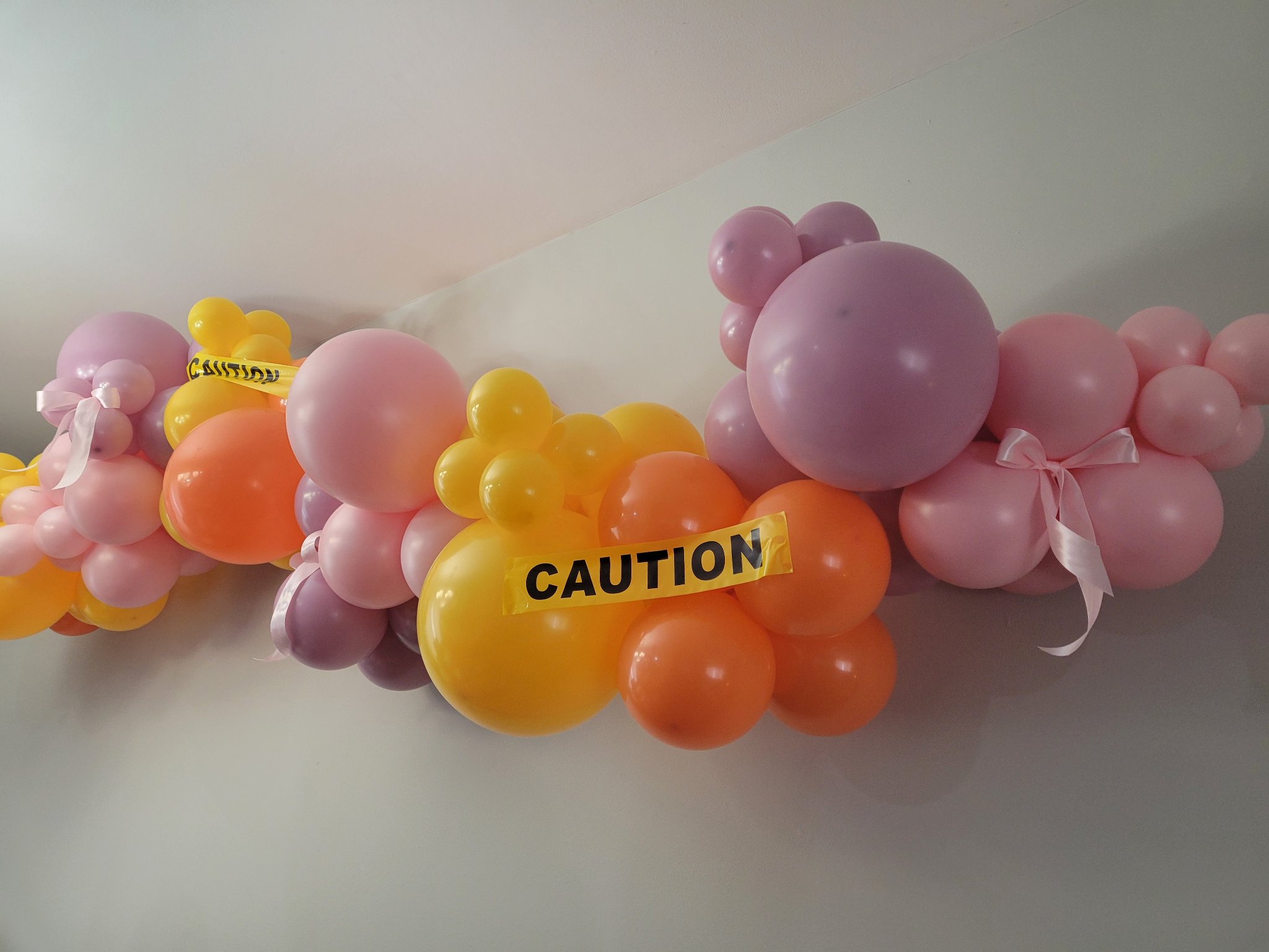 Trucks and tutus birthday balloon garland by Balloon Trace in Joliet IL