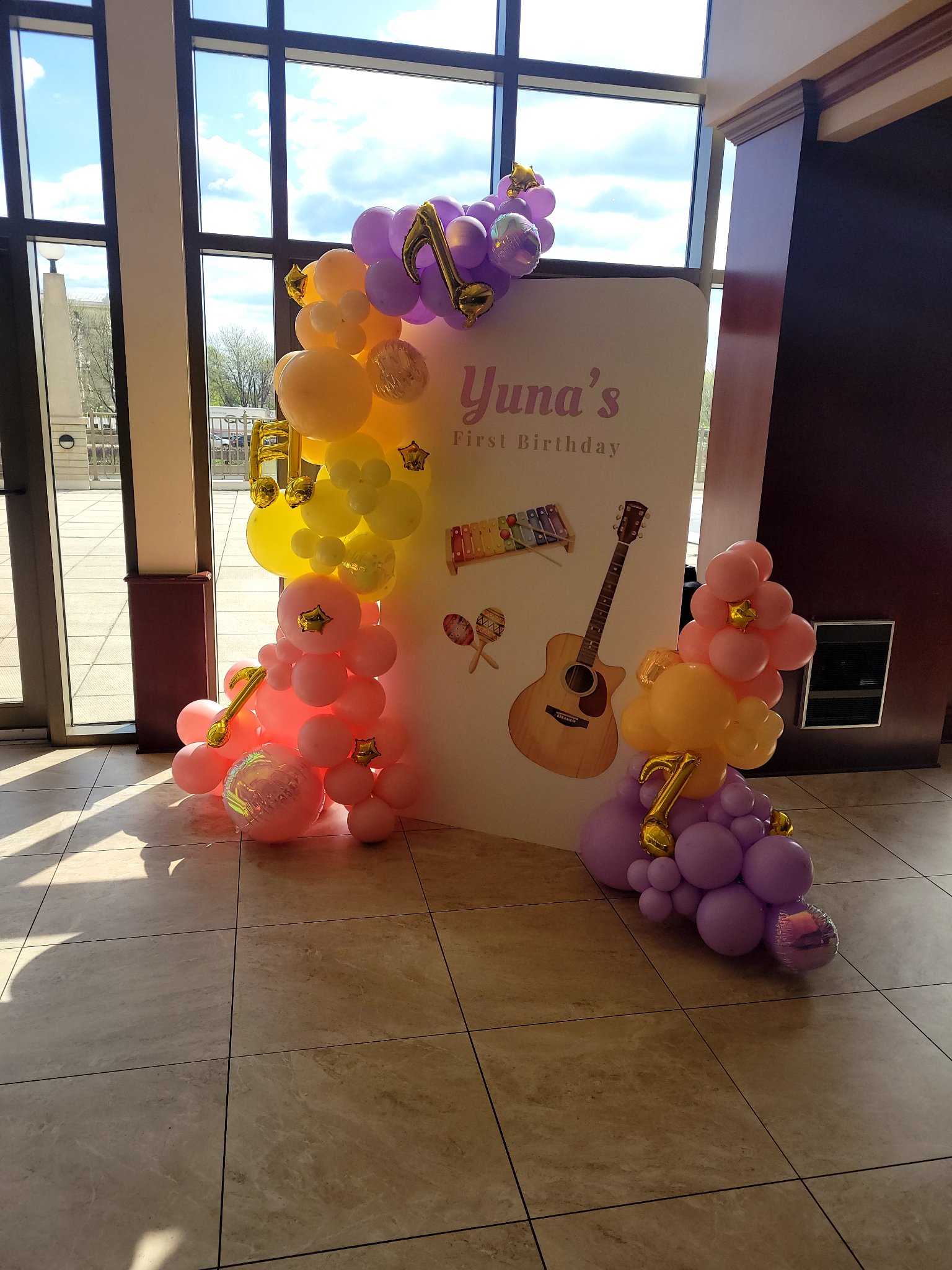 Music themed first birthday rainbow balloon garland backdrop by Balloon Trace Joliet